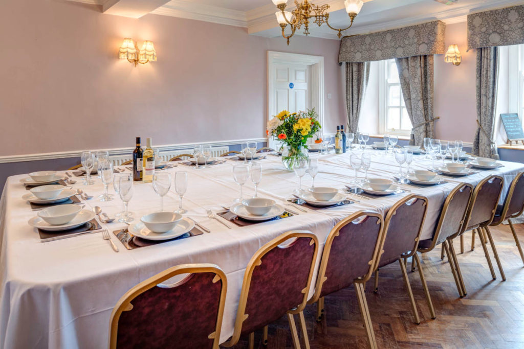 Dining table set for a group Christmas dinner at Toft Estate