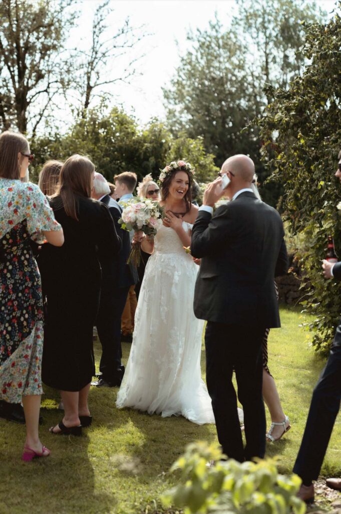Bride and guests at an intimate wedding at Toft Estate