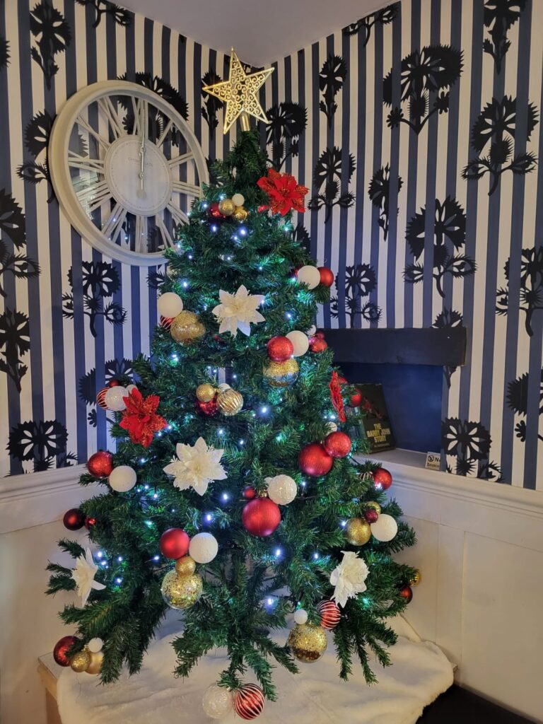 Christmas tree and fireplace at Toft Estate